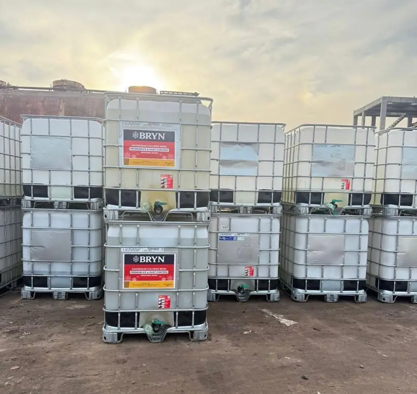 Bryn labelled IBC totes stacked two high in the Monroe yard
